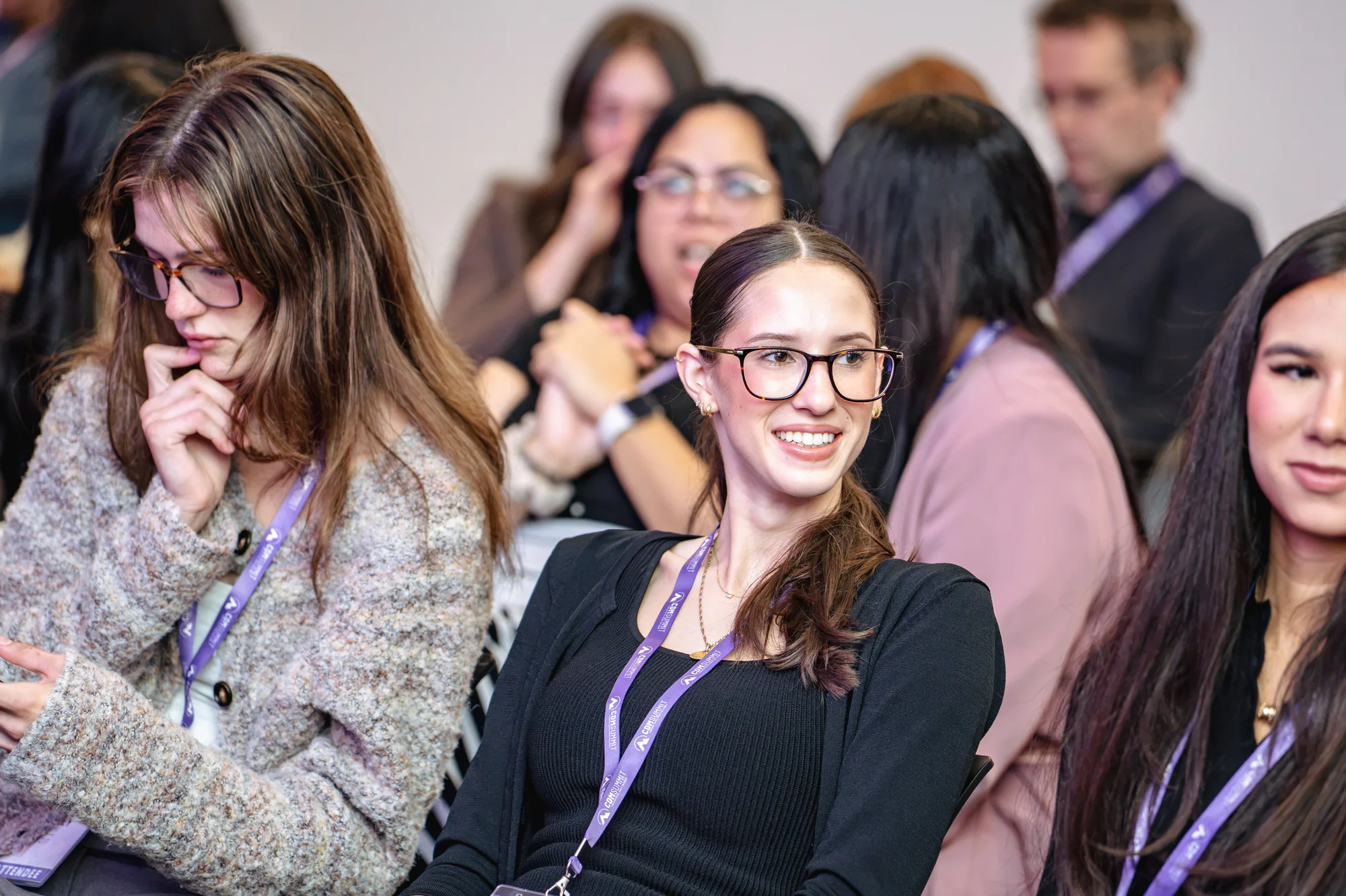An attendee smiling in the audience at CDM Summit Fraser Valley 2026