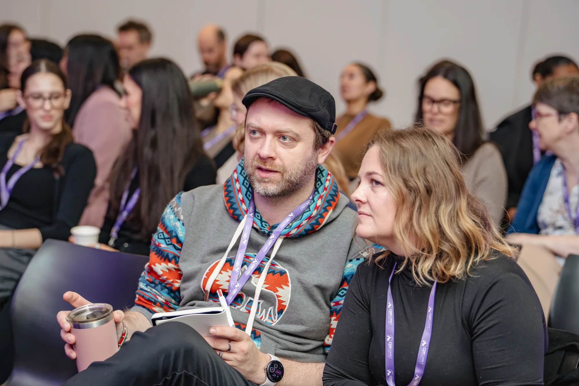 Two attendees listening in the audience at CDM Summit Fraser Valley 2026