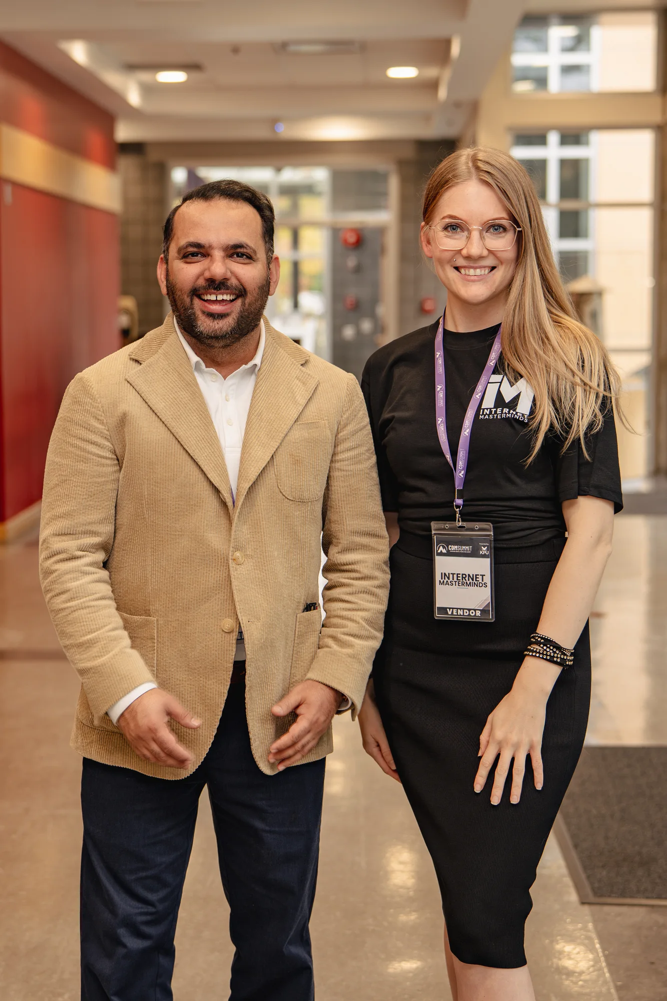 A smiling attendee in a tan blazer networking at CDM Summit Fraser Valley 2026